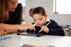 Featured Image for boy with down syndrome using tablet