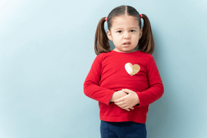 Featured Image for Ethnic school girl with stomachache