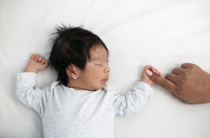 Featured Image for Asian baby in crib