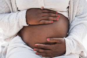 Featured Image for Pregnant black woman holding belly