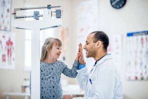 Featured Image for Girl with down syndrome giving high five