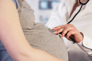 Featured Image for doctor examining a pregnant woman