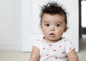 Featured Image for baby boy sitting on carpet