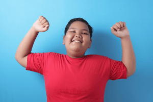 Featured Image for smiling diverse teen arms raised