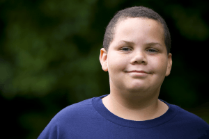 Featured Image for smiling biracial overweight teen