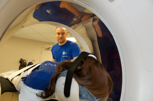 Featured Image for radiology tech performs ct scan