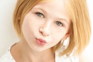 Featured Image for close up of teen girl with freckles