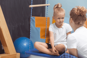 Featured Image for young girl talking to physical therapist