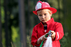 Featured Image for little fire man in the garden with the water hose