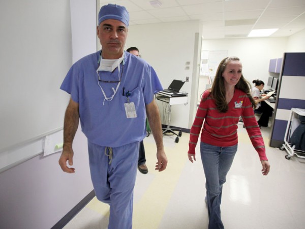 After surgery, Dr. Milo takes Megan back to recovery to see Jordan.