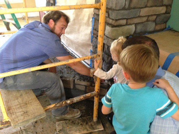 Randy, Jordan and Gabriella talking to construction worker