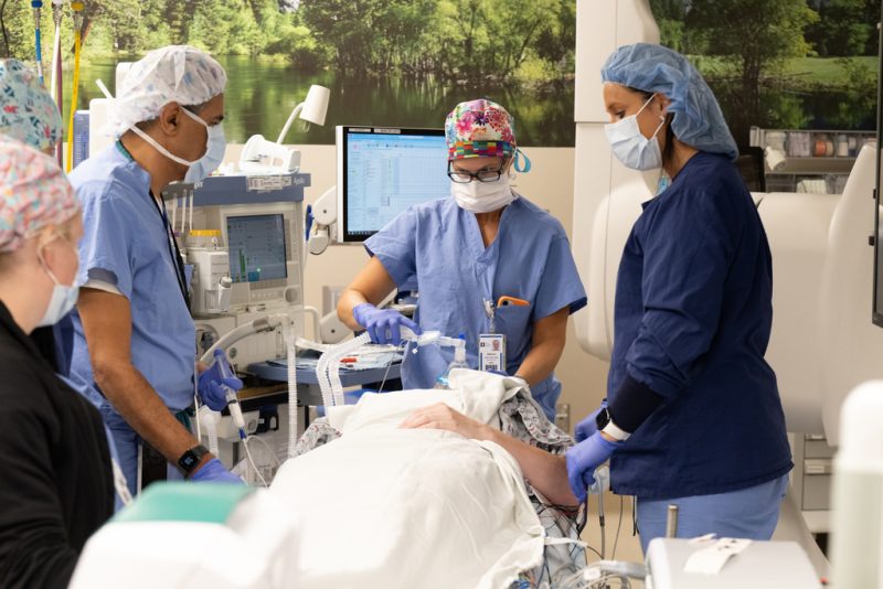 Anesthesia team works with a patient before surgery